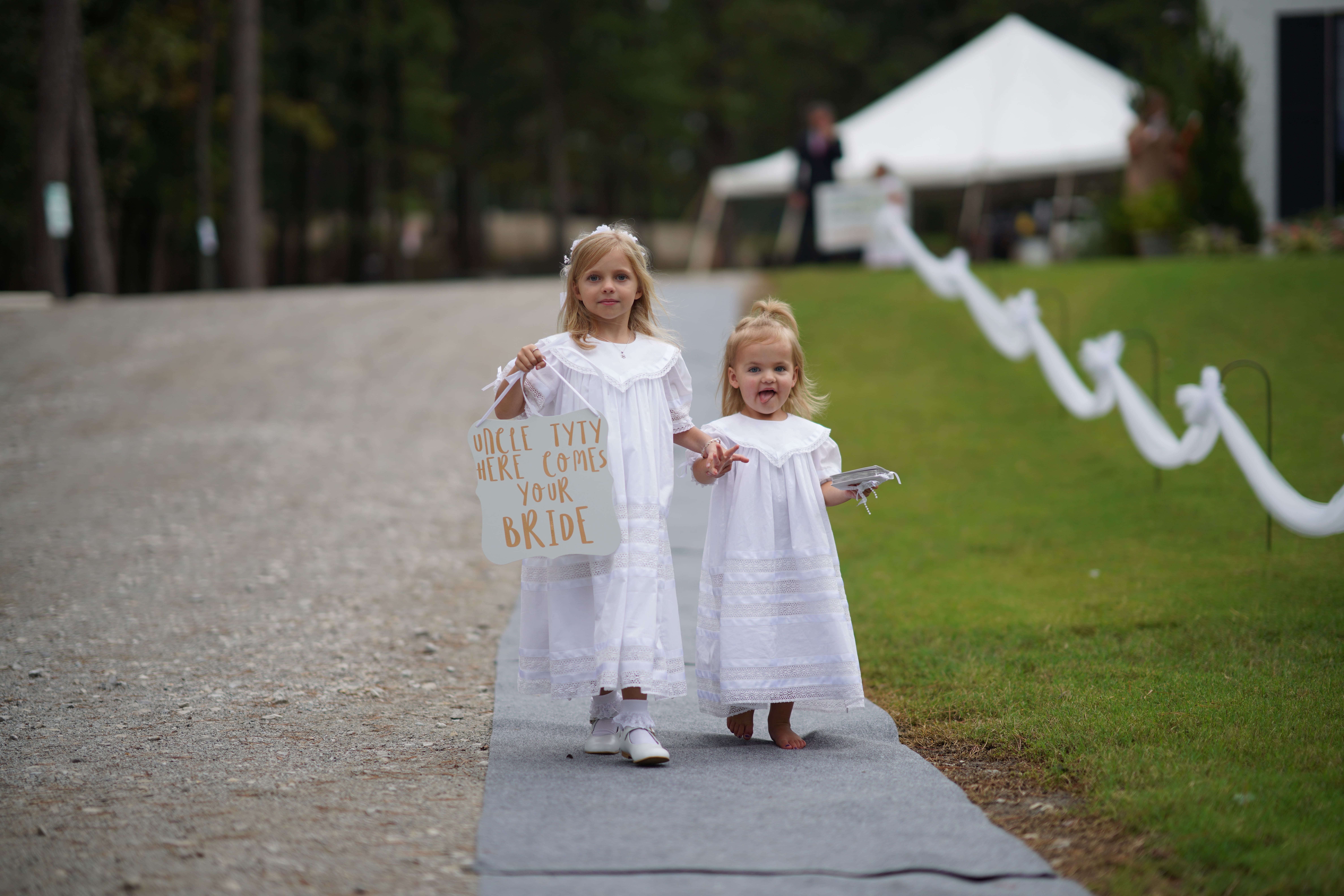 flower girls walking down aisle