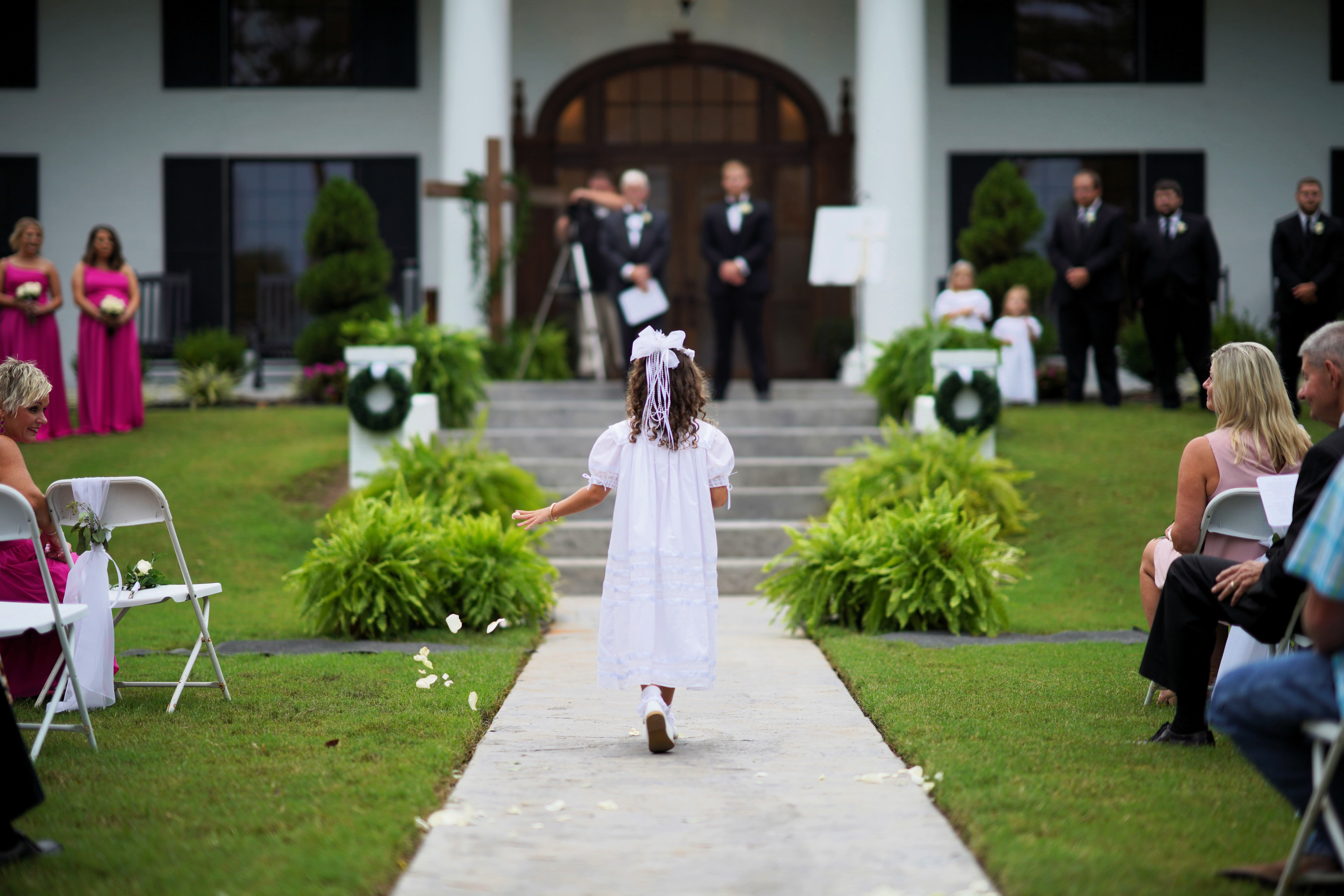 flower girl walking down aisle