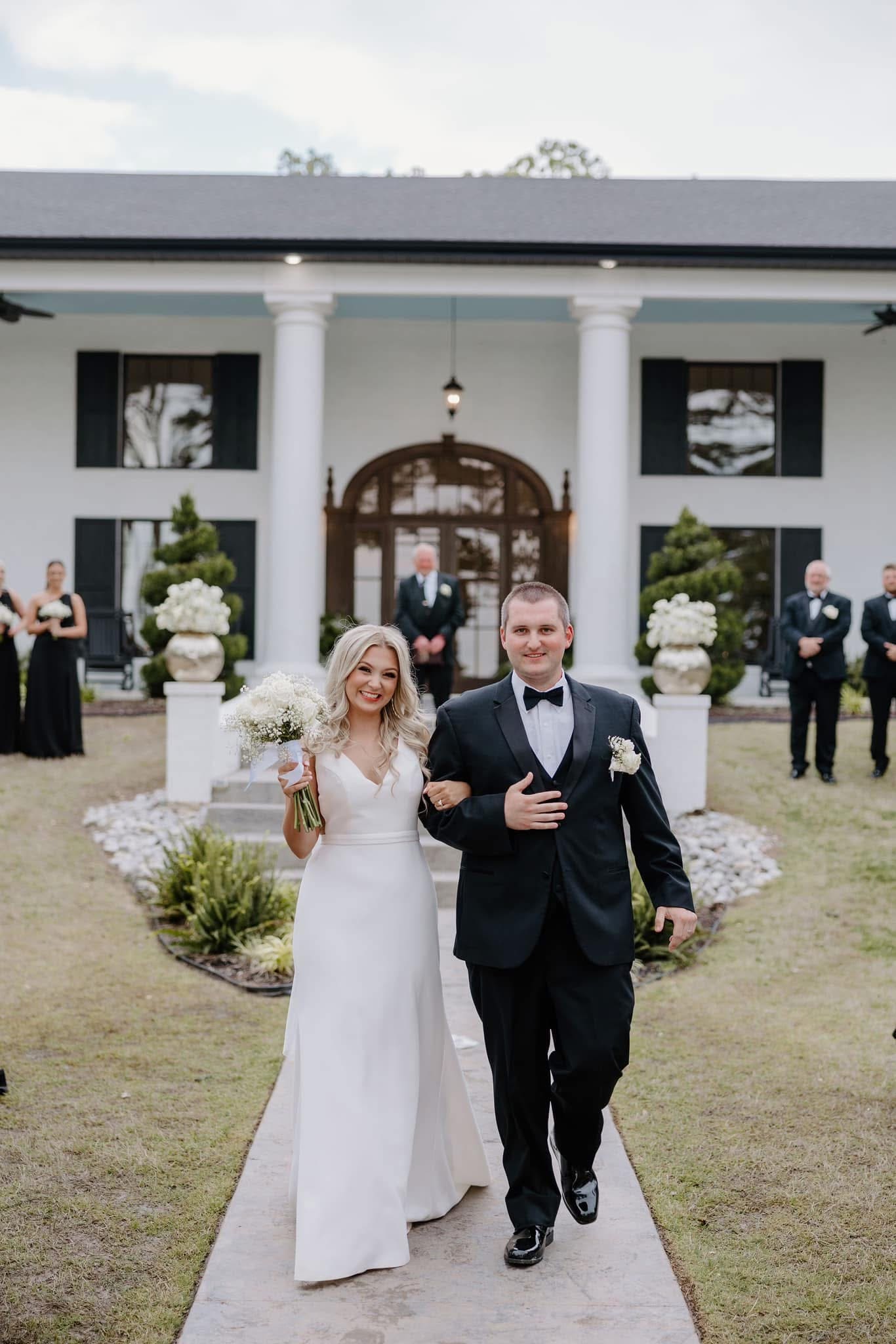 bride and groom walking down aisle